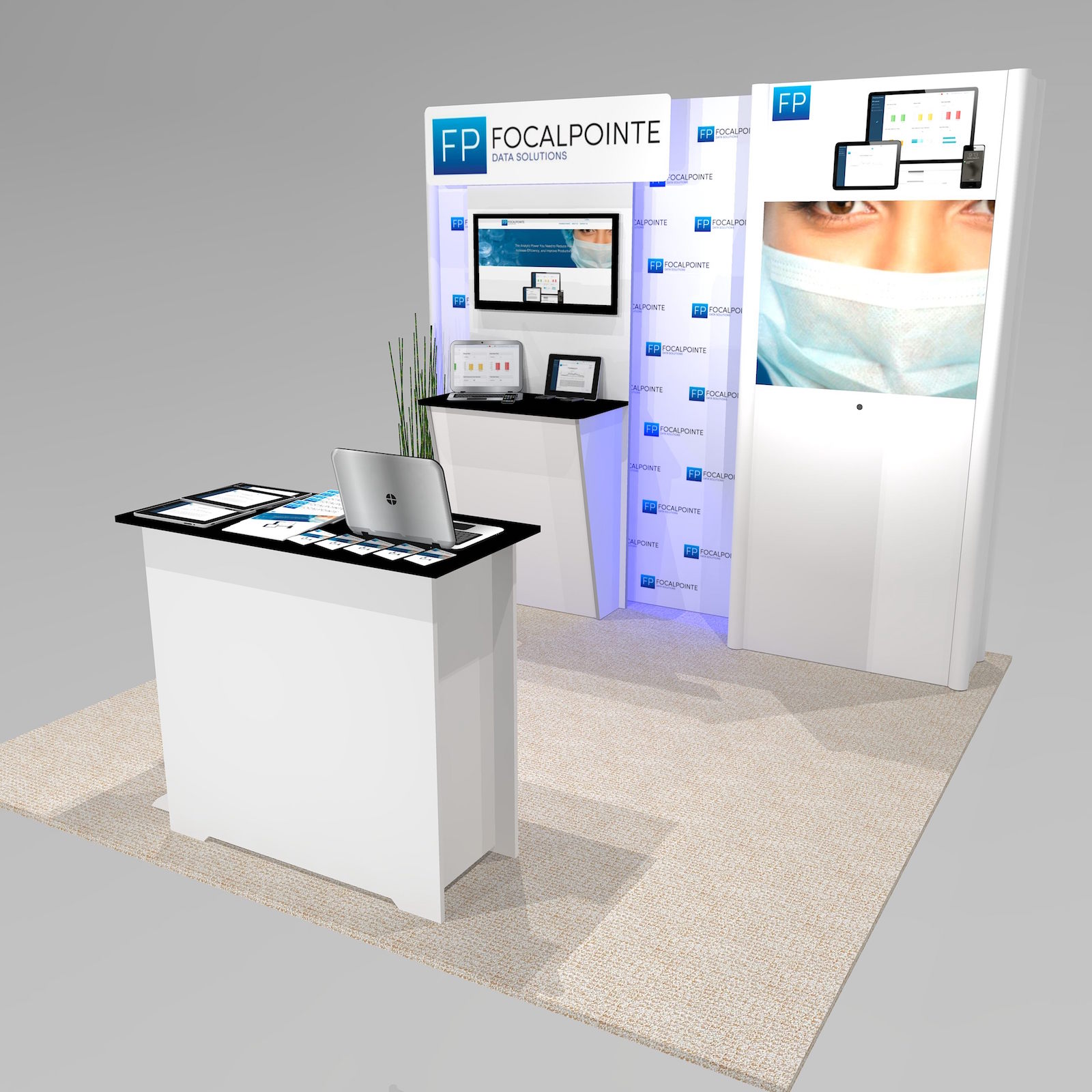 The IM1 trade show booth design features a large back lit image on the tower, with silhouette lighting behind the monitor wall section. Panel and logo sign above stand 6” in front of the main back wall for a custom 3D look.