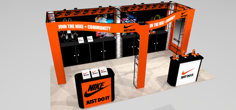The JAD1020 presents a bold graphic message on the trade show floor! Two large mural walls and built-in counters below provide lots of storage with great visibility. Plenty of storage and counter space, is perfect for displaying product and more. Customizable to add video monitors, additional lighting, shelves, and laptop workstations. View 2