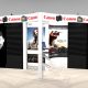 NAP1020 Exhibit rental showcases slat wall and graphics with a unique 20′ x 10′ trade show booth featuring opposite curved ends with a center curve and three flat 34.5″ wide panels. Optional Radius Headers in three different configurations. View 1