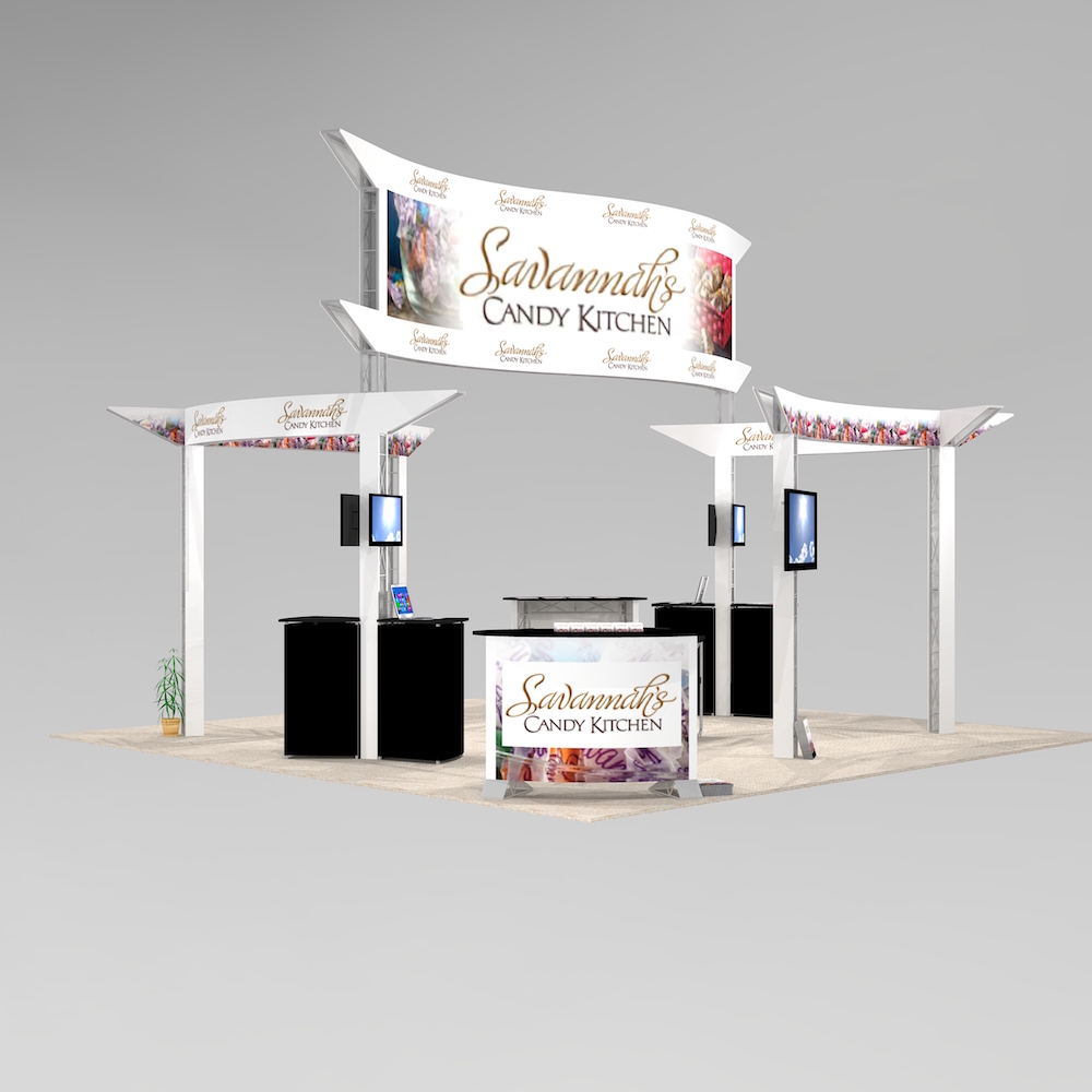 The PAL2020 island exhibit design features multiple panels with distinctive curved shapes and large logo graphics for optimal trade show visibility. Towers to showcase products and monitor screen workstations. View 2