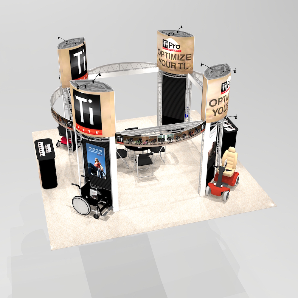 The PRE2020 Island Exhibit has large graphic towers with ample seated meeting space. Two reception counters are located near the aisles to for greet client visibility. Customizable design with lighting and signage to improve functionality and design. View 2