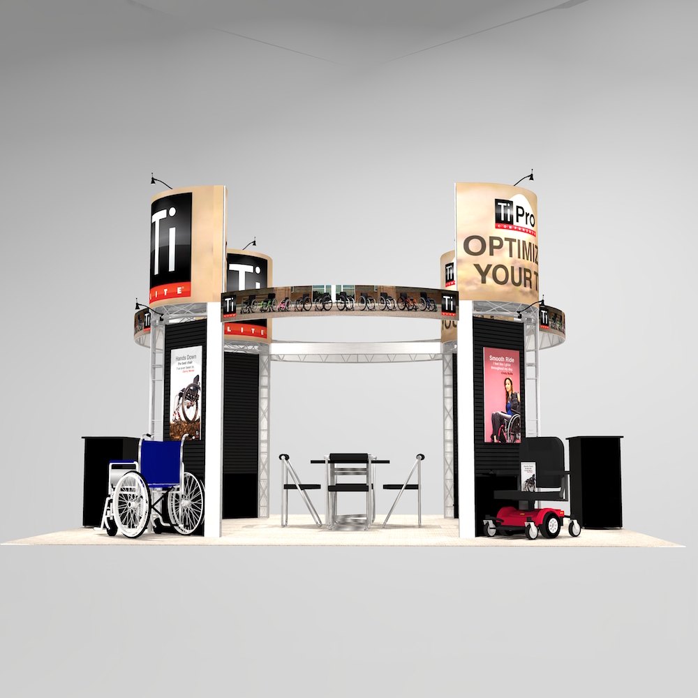 The PRE2020 Island Exhibit has large graphic towers with ample seated meeting space. Two reception counters are located near the aisles to for greet client visibility. Customizable design with lighting and signage to improve functionality and design. View 3