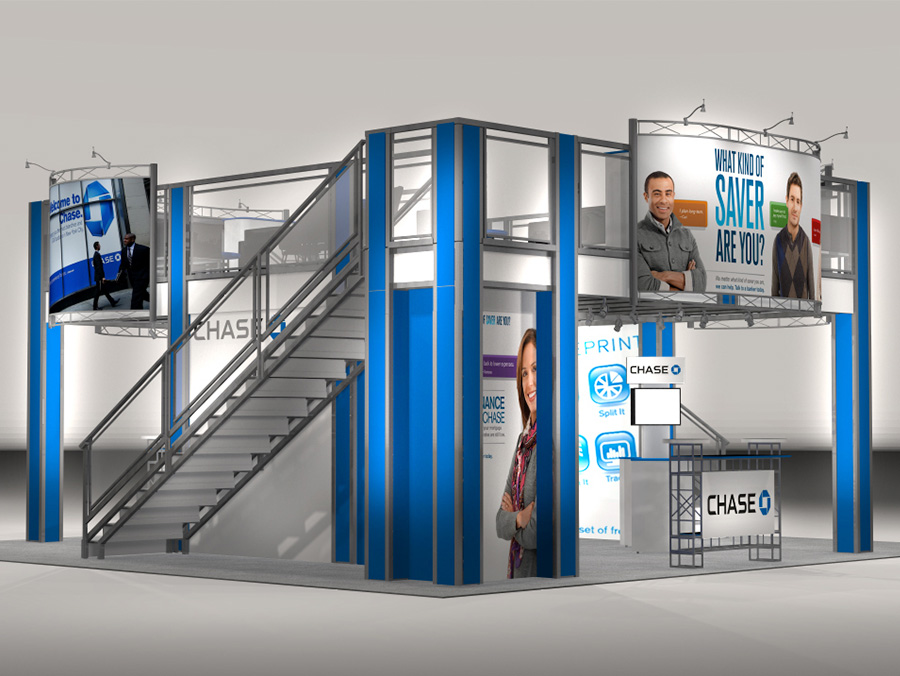 The TR3030 Double Decker trade show exhibit has an expansive 27 x 17 deck with 2 straight staircases on opposing sides to access the second story. Plenty of storage space located below the stairs and landings and a spacious upstairs Meeting or hospitality space. View 1