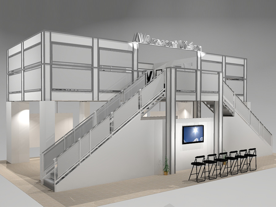 This double deck trade show exhibit VL5030 includes private and semi-private rooms into a 50 x 30 space and maintain floor space for products. A raised upper deck offers the highest lower level ceiling available on the trade show floor, and upstairs, more rooms with an expansive lounge accessible by 2 grand staircases. View 2